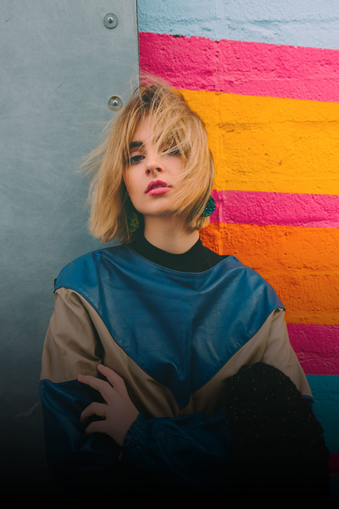 Women is standing in front of the camera and posing